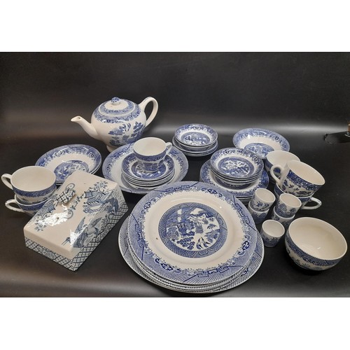 1130 - A Large Quantity of Blue and White Chinaware in Willow Design. Includes a Teapot, 6 Cups, 6 Large Pl... 