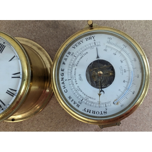 334 - A Brass Ships clock and barometer