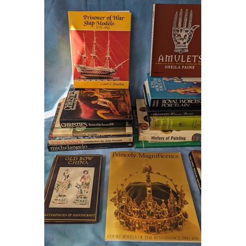 311 - An assortment of reference books - Amulets, Cashmere, Prisoner of war ship models