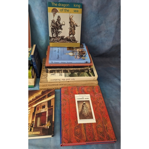 311 - An assortment of reference books - Amulets, Cashmere, Prisoner of war ship models