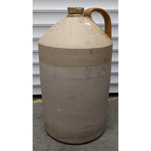 412 - A pair of Salt glazed flagon with 'Bowden & Co. Bournemouth' - Large 58 x 33 - Small 36 x 19cm (has ... 