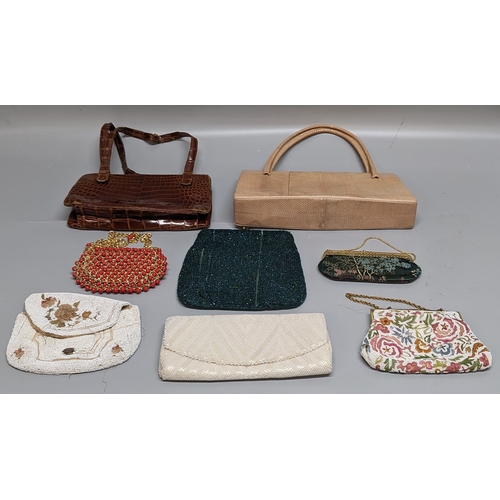 784 - A collection of Vintage handbags and clutches