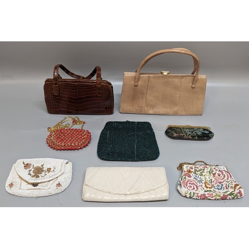 784 - A collection of Vintage handbags and clutches