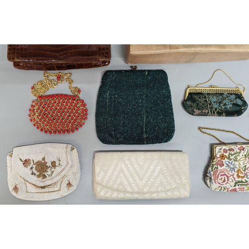 784 - A collection of Vintage handbags and clutches