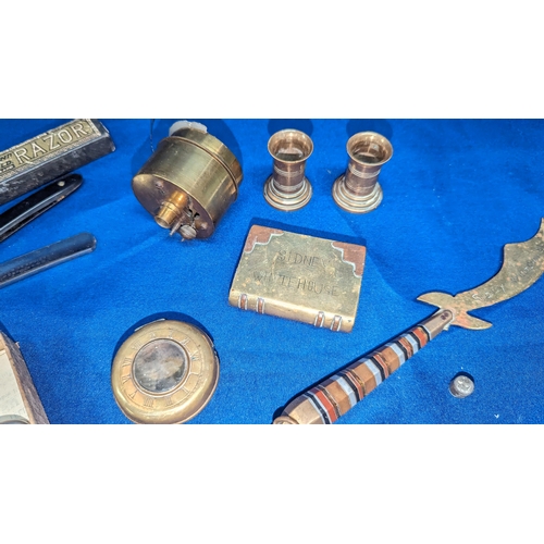 152 - An assortment of oddments including Trench Art, Bullet lighter, Brass watch case, Cut throat razor e... 