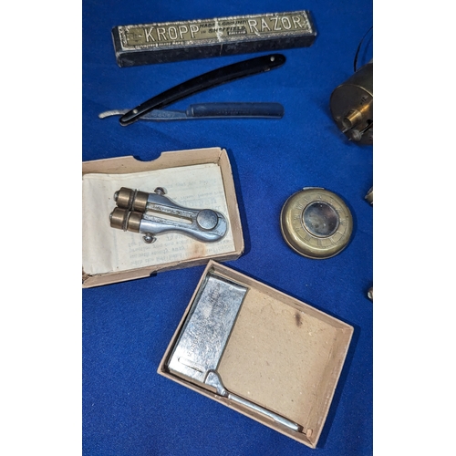 152 - An assortment of oddments including Trench Art, Bullet lighter, Brass watch case, Cut throat razor e... 