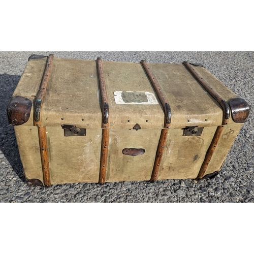 46 - A large wood and brass bound canvas trunk - 104 x 50 x 55cm