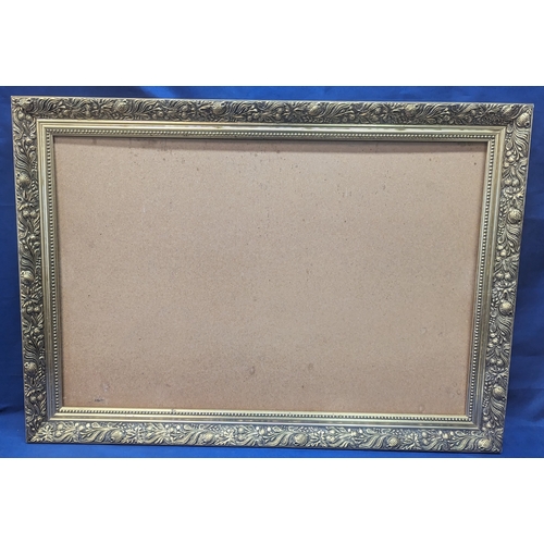 650 - An ornate gilt picture frame - 87 x 62cm