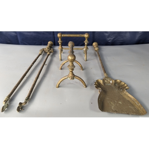 799 - A pair of Brass fire dogs with a set of fire tongs and shovel