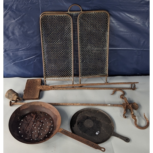 950 - Cast iron waffle iron, antique balance, 2 iron pans and brass fireguard