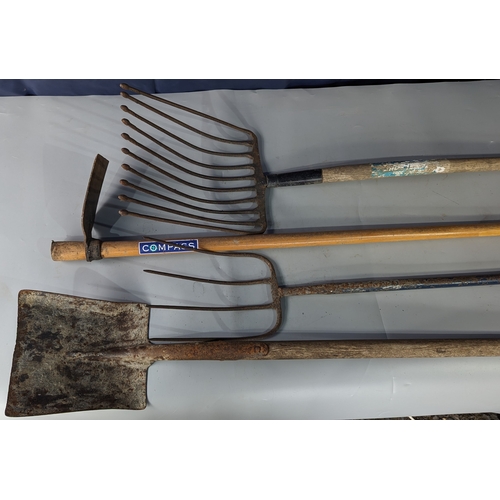 969 - Selection of garden tools including - Shovel fork, pick, and potato fork