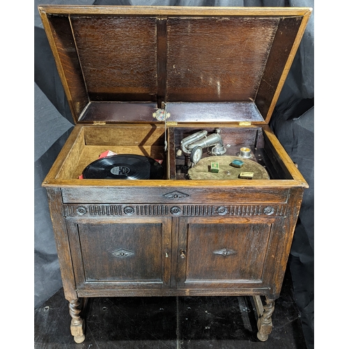 899 - A Gilberts Gramaphone in original cabinet with assorted styluses - one handle missing as pictured - ... 