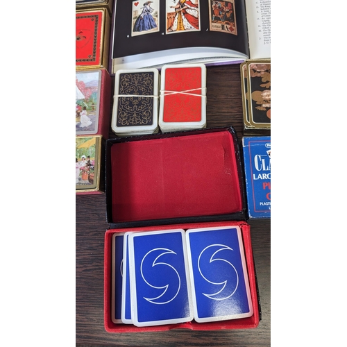 511 - A collection of assorted vintage playing cards and pencils - PLUS - 'Playing cards and their history... 