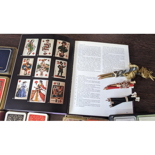 511 - A collection of assorted vintage playing cards and pencils - PLUS - 'Playing cards and their history... 