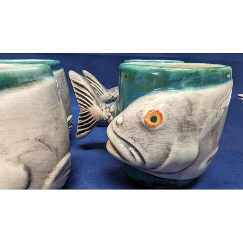 716 - A set of 6 handmade Porcelain Fish mugs with fishtail handles - 8cm tall. 5 with white insides - 1 w... 