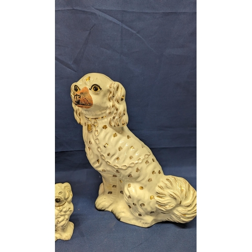 724 - 3x Antique Porcelain Staffordshire style Spaniel dogs - 2 x 32cm high approx - 1x 12cm high approx -... 