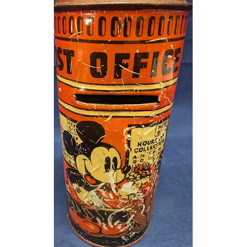 725 - 1930's Mickey Mouse Tin money box - In used condition - 15cm tall, 6.5cm diameter