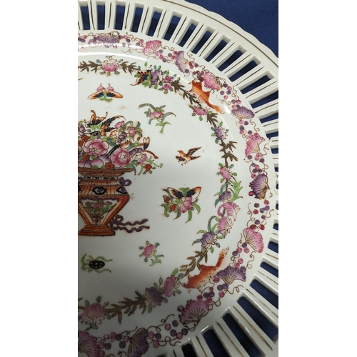 735 - A pair of antique pierced porcelain floral insect and bird decorated plates.   From the country esta... 