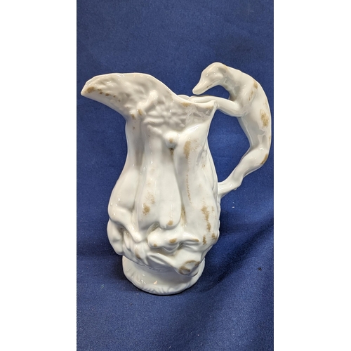 697 - Vintage White Porcelain Greyhound Handled Pitcher 14cm High with Body Depicting Game. Purchased at N... 