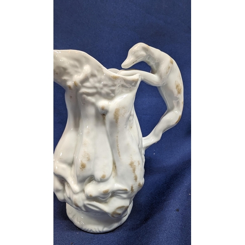 697 - Vintage White Porcelain Greyhound Handled Pitcher 14cm High with Body Depicting Game. Purchased at N... 