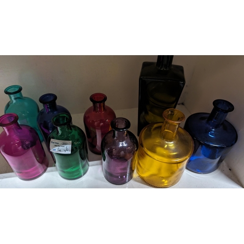 745 - A Selection of 9 x Coloured Vintage Bottles - Tallest 23cm.   From the country estate.