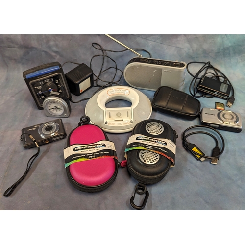 1084 - An assortment of electrical items, portable speakers, digital cameras, iPod dock etc.