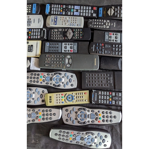 874 - Large selection of mixed remote controls.