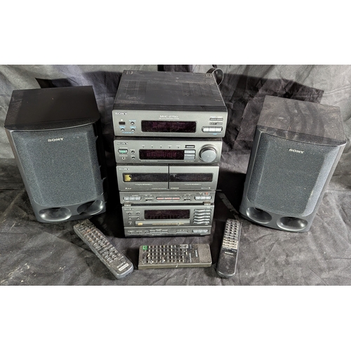 887 - Sony Midi system with 5 disc changer, double cassette, amp, receiver, 2 speakers and remotes