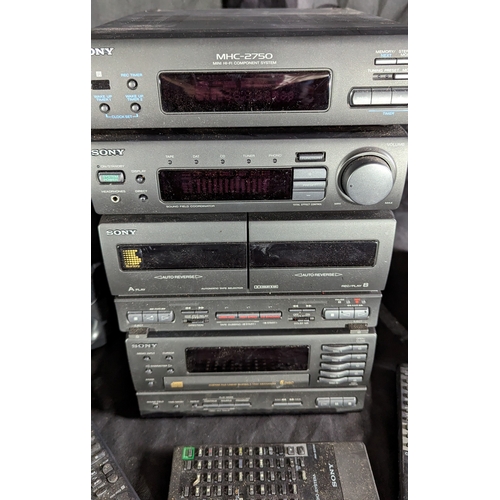 887 - Sony Midi system with 5 disc changer, double cassette, amp, receiver, 2 speakers and remotes