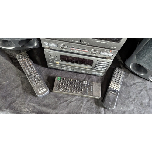 887 - Sony Midi system with 5 disc changer, double cassette, amp, receiver, 2 speakers and remotes