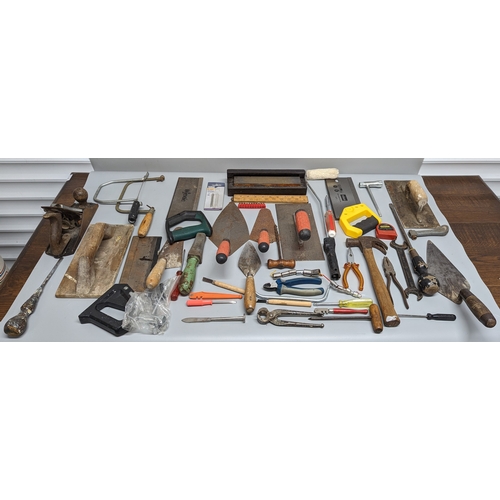 981 - A box of tools including hammers, spanners and more