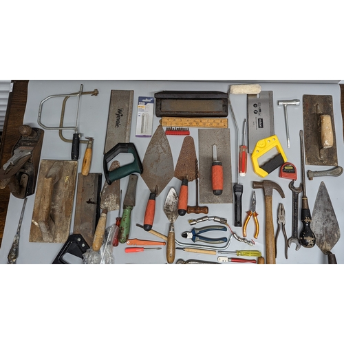 981 - A box of tools including hammers, spanners and more