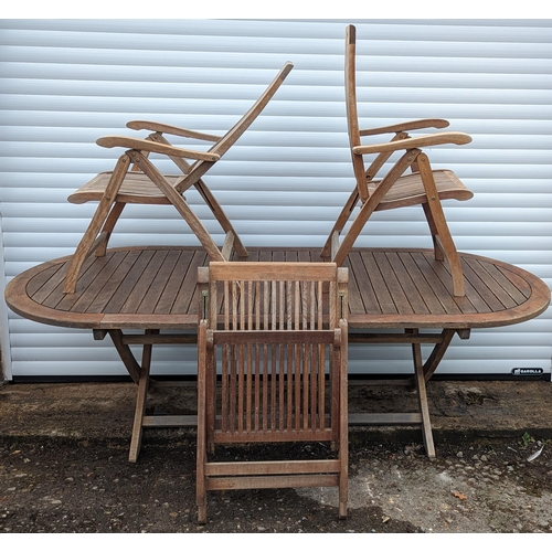 930 - Large folding Teak garden table and 8 folding Teak chairs made by Pagoda