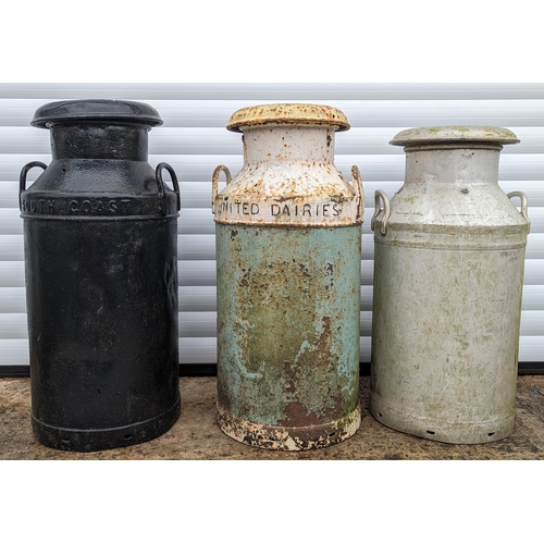 933 - 3 Milk churns - 
Black - South Coast Dairies
Blue and White - United Dairies 
Galvanised - United Da... 