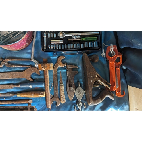 1028 - A box of mixed tools including spanners, 40 piece socket set and much more