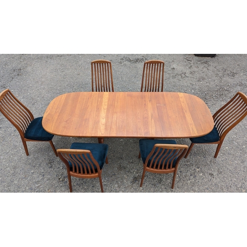 12 - Danish Glastrup teak table and 6 Chairs finish with teal seat covers - 73 x 140(closed) x 224 (open)... 