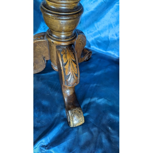 556 - Brown Leather topped stool on carved tripod legs