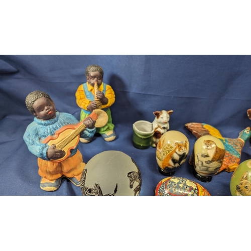 741 - A collection of vintage items including - carved wooden and hand painted eggs, geese, zebra paperwei... 