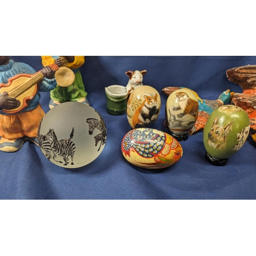 741 - A collection of vintage items including - carved wooden and hand painted eggs, geese, zebra paperwei... 