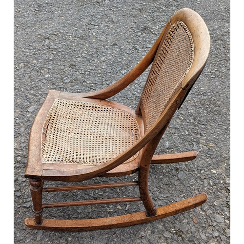 447 - Rattan Rocking Chair and a Cane Arm Chair