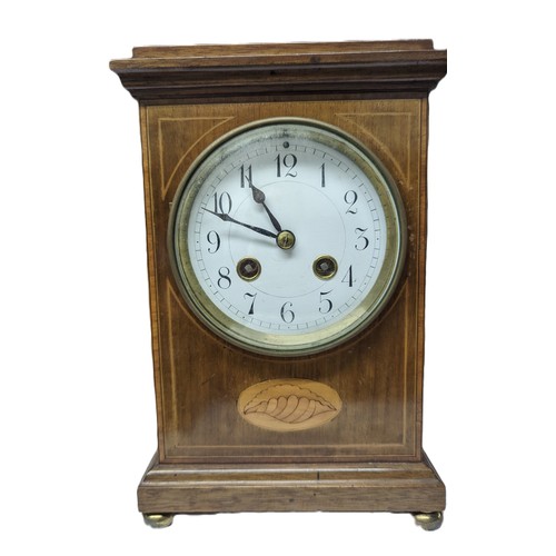 38 - An Edwardian mantle clock, enamel dial, satin wood shell pattern