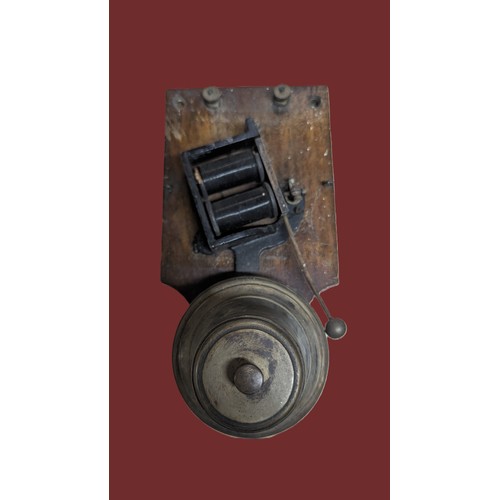 54 - An antique wood and brass Victoria electric door bell