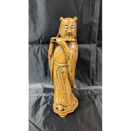 105 - An Antique Carved Stone Chinese Flute Player