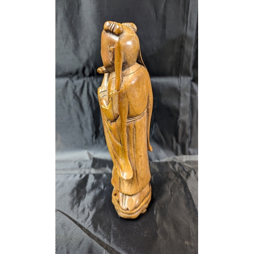 105 - An Antique Carved Stone Chinese Flute Player