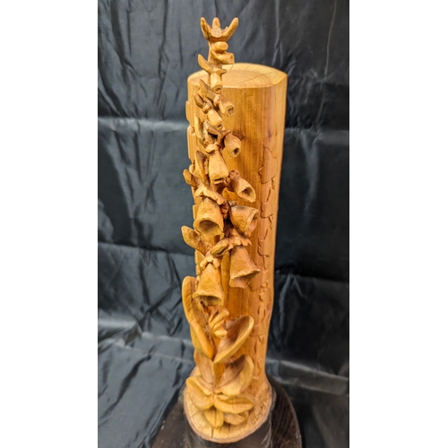 119 - A Carved Foxglove Ornament 44cm