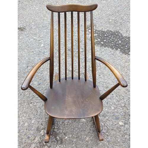 102 - A pair of Ercol Windsor rocking chairs - Goldsmith