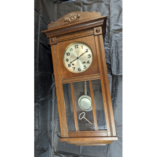 1242 - A Vintage Wall Clock with Pendulum and Key