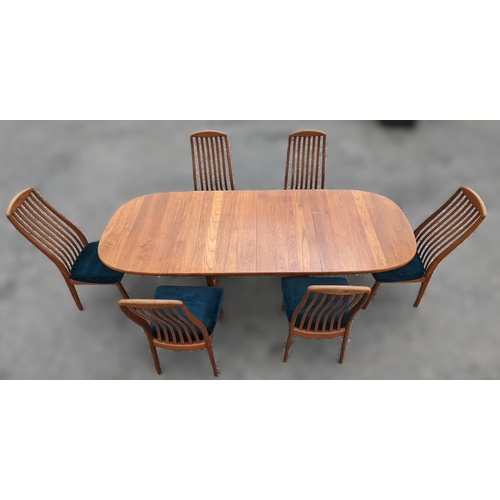 12 - Danish Glastrup teak table and 6 Chairs finish with teal seat covers - 73 x 140(closed) x 224 (open)... 