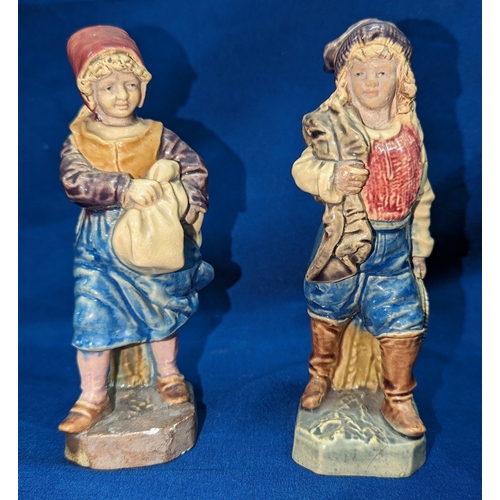 57 - A pair of Bruders Urbach Majolica figures (some repairs to bases as pictured)