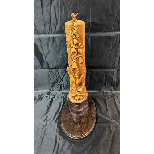 119 - A Carved Foxglove Ornament 44cm